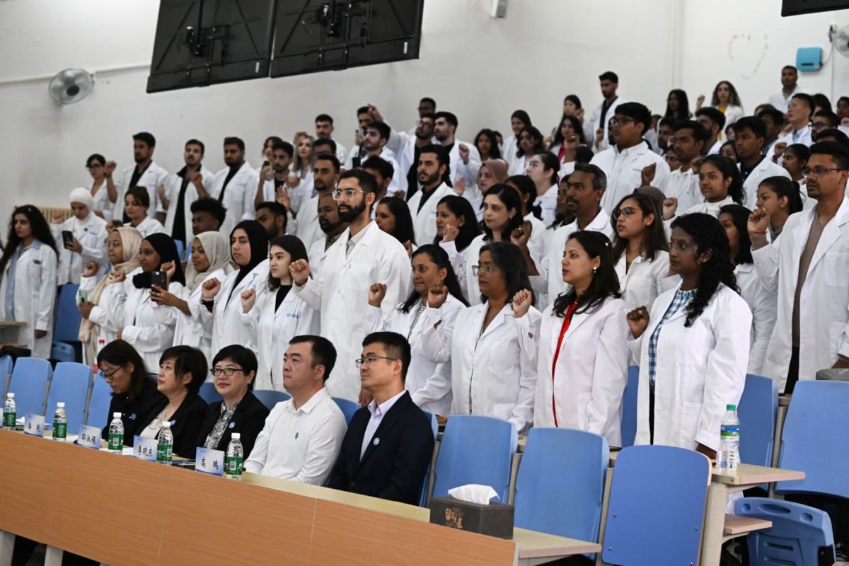 International medical students taking the oath at Dalian Medical University