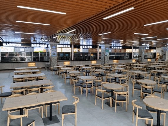 Interior seating area in a Guangzhou Medical University campus dining hall