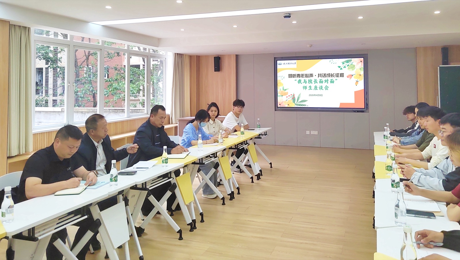 Students and staff in a community meeting at Kunming Medical University